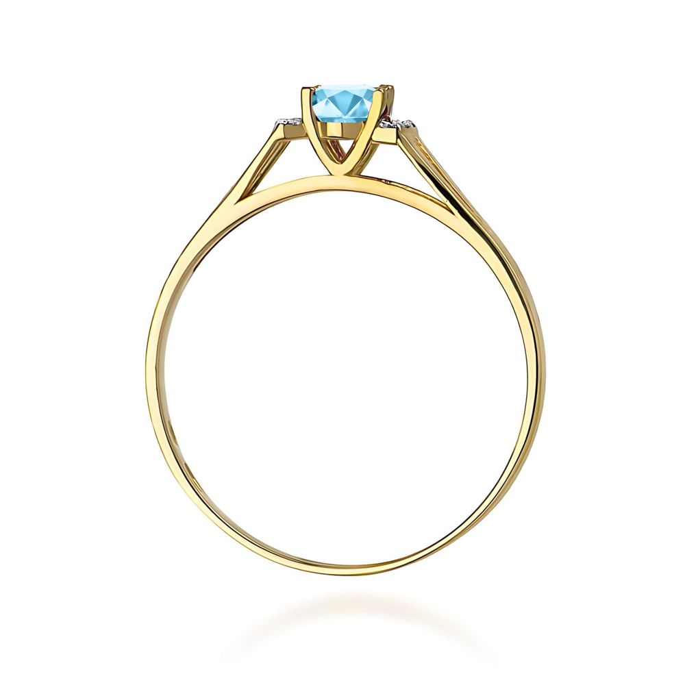 Pierścionek z topazem Swiss Blue 0,50 ct i brylantami, żółte złoto 585